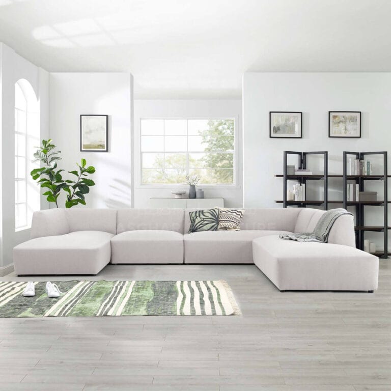 A contemporary living room featuring white sofa and a vibrant green rug, creating a fresh and inviting atmosphere.