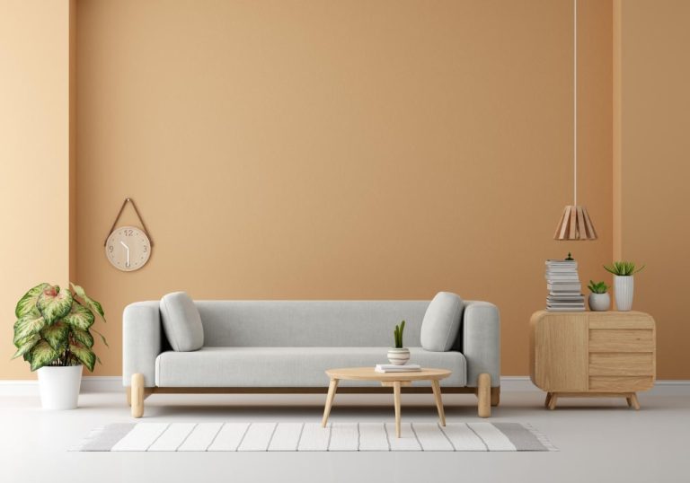 A cozy living room featuring a comfortable couch and a stylish table, creating a welcoming atmosphere.